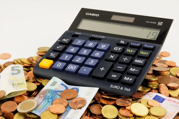 calculator lying on money